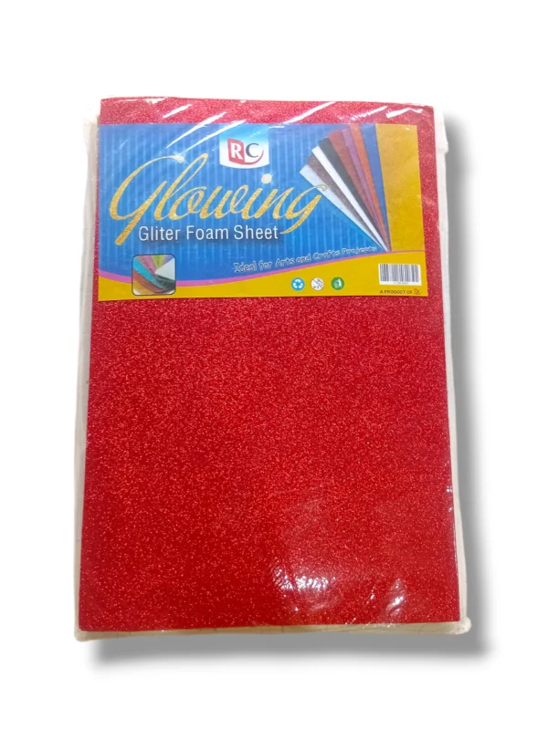 Child cutting glitter foam sheet with scissors