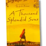 The Kite Runner and A Thousand Splendid Suns book covers by Khaled Hosseini.