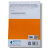 Student reading Wren & Martin English Grammar book