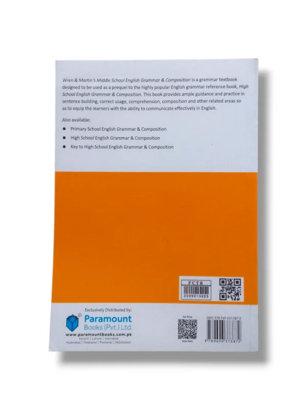 Student reading Wren & Martin English Grammar book